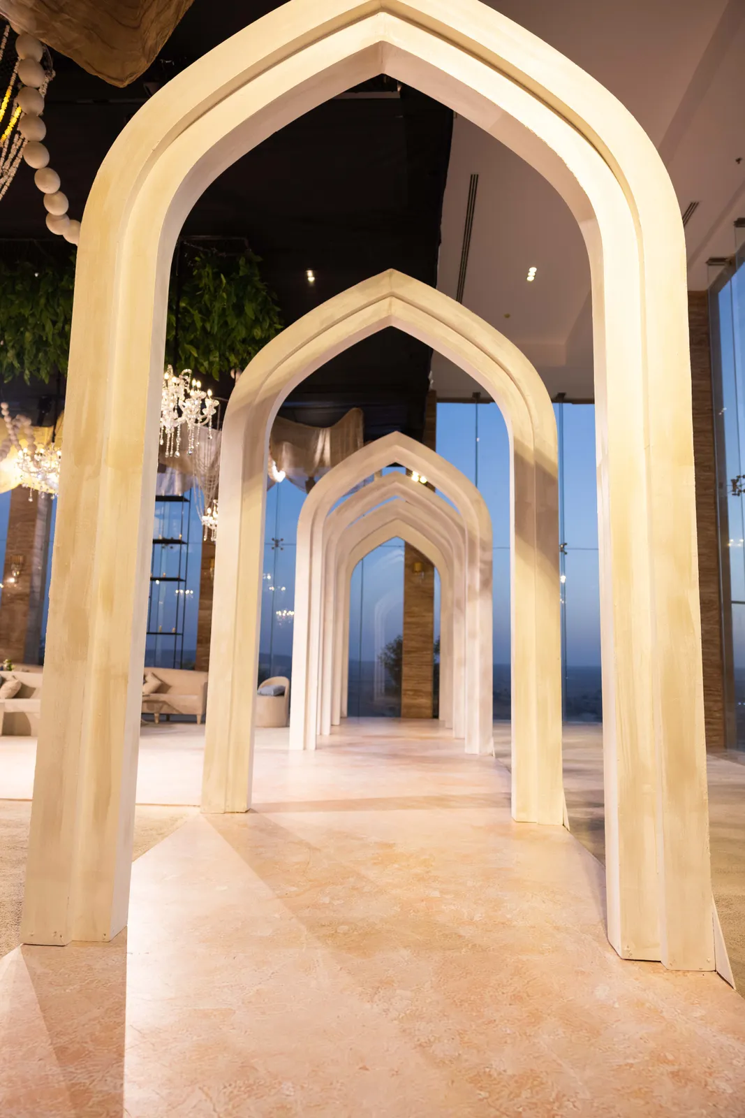 Symmetrical gothic archway silhouetted at sunset